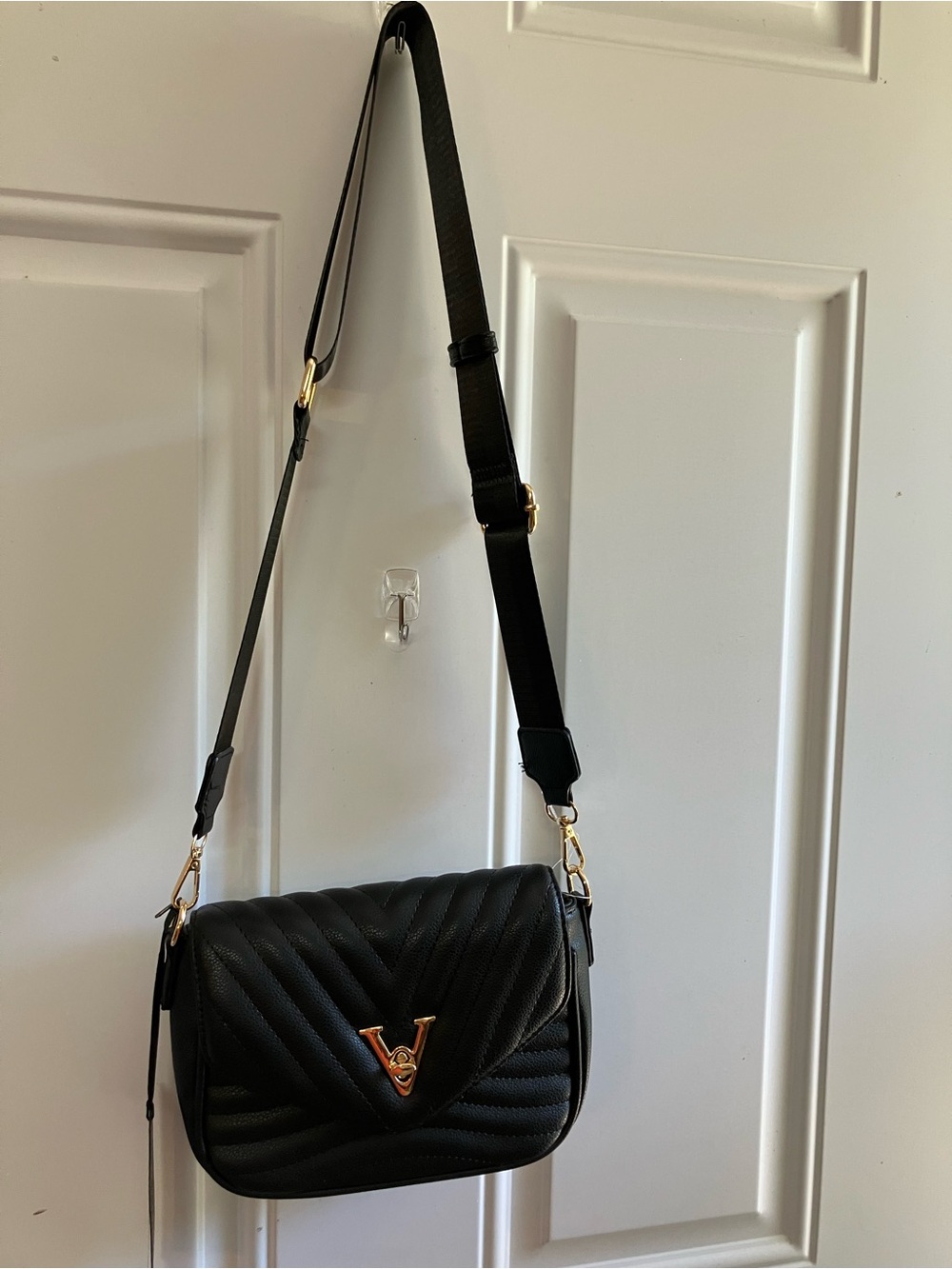 Black Quilted Crossbody Bag with Gold V Accent
